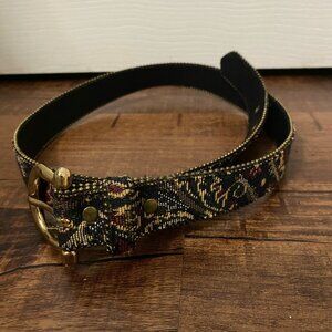 Floral gold red and blue beaded belt with a gold belt buckle.